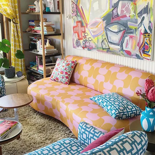 Mid-century modern pink and orange couch.